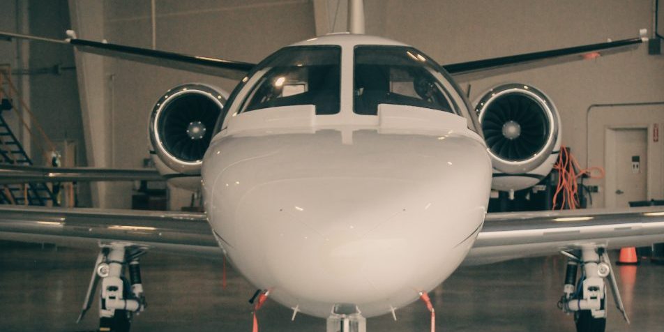 Nose of airplane in hangar